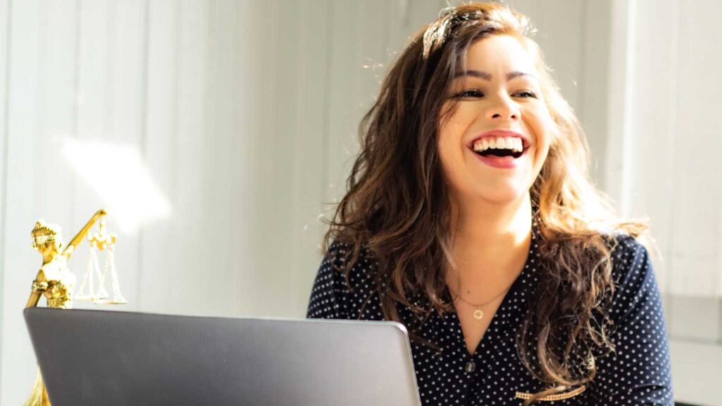 Woman laughing at work